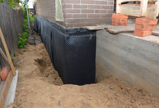 SJ Waterproofing Pros technician performing targeted Waterproofing assessment in Aurora, IL